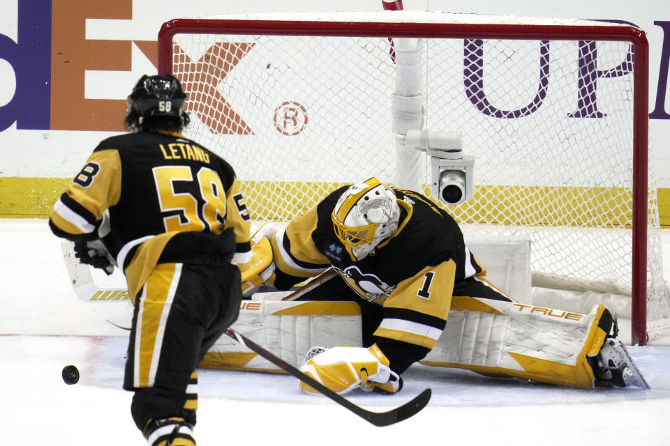 Pittsburgh Penguins goaltender Casey DeSmith (1) stops a shot during the second period of an NHL hockey game against the Washington Capitals in Pittsburgh, Saturday, March 25, 2023. (AP Photo/Gene J. Puskar)