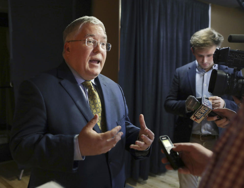 FILE - In this Nov. 1, 2018, file photo, Patrick Morrisey speaks to reporters after a debate in Morgantown, W.Va. West Virginia's Roman Catholic diocese has released the names of nine more priests who it said have been credibly accused of child sexual abuse. West Virginia Attorney General Patrick Morrisey in March 2019 filed a lawsuit accusing the diocese and former Bishop Michael Bransfield of knowingly employing pedophiles and failing to conduct adequate background checks on camp and school workers. (AP Photo/Raymond Thompson, File)