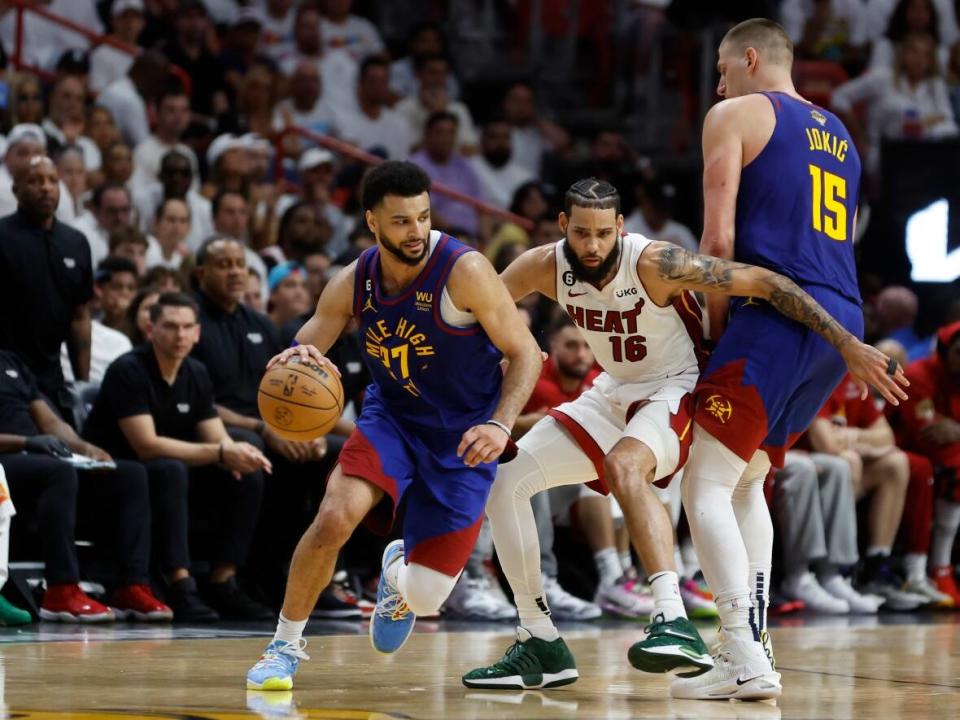 Canadian Jamal Murray, with ball, and teammate Nikola Jokic, right, made history in Game 3 of the NBA Finals.  (Getty Images - image credit)
