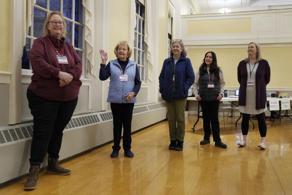 Poll workers hold a meeting before the polls open in Kennebunk, Maine, Tuesday, March 5, 2024. Super Tuesday elections are being held in 16 states and one territory. Hundreds of delegates are at stake, the biggest haul for either party on a single day.   (AP Photo/Michael Dwyer)