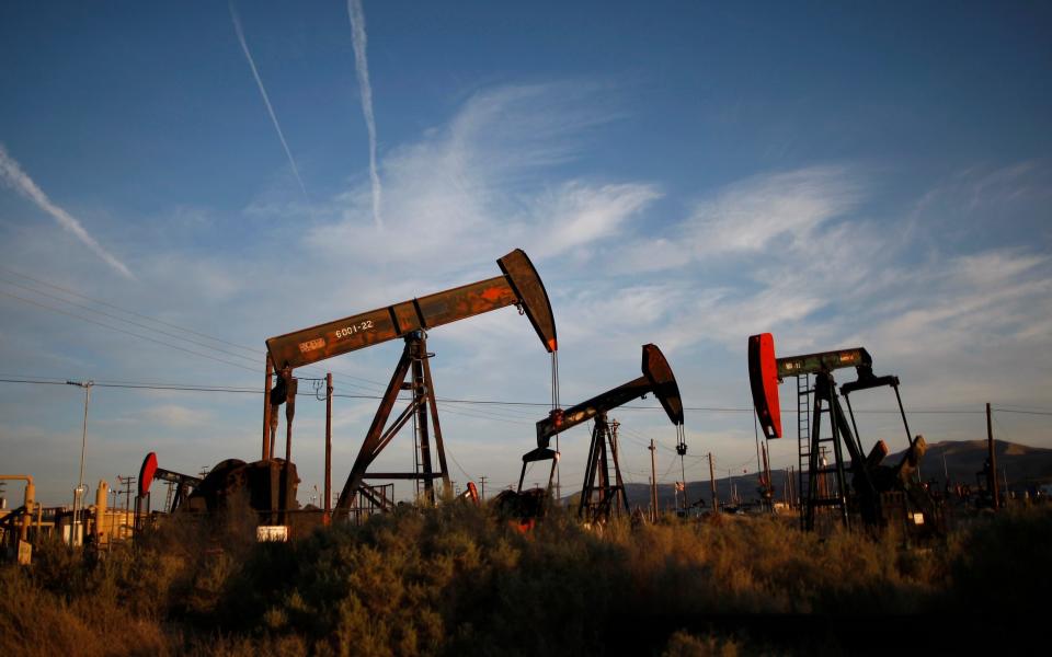 Pump jacks and wells in an oil field on the Monterey Shale formation in McKittrick, California, 2014