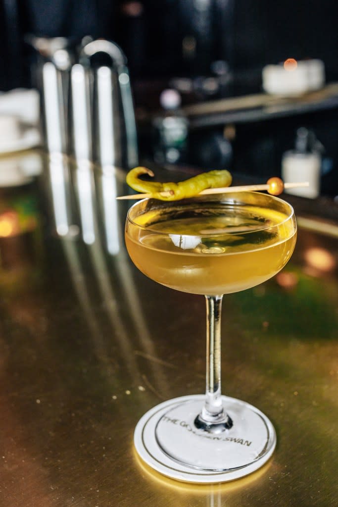 The Golden Swan Martini, crafted by head bartender Andy May, is a unique blend of sugar, spice and everything nice, including mezcal, pineapple and chili. EMMY PARK