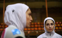 Iranian volleyball players Maedeh Borhani (L) and Zeinab Giveh talk during an interview following a training session of "Shumen" volleyball club in Shumen, Bulgaria January 14, 2017. Picture taken on January 14, 2017. REUTERS/Stoyan Nenov