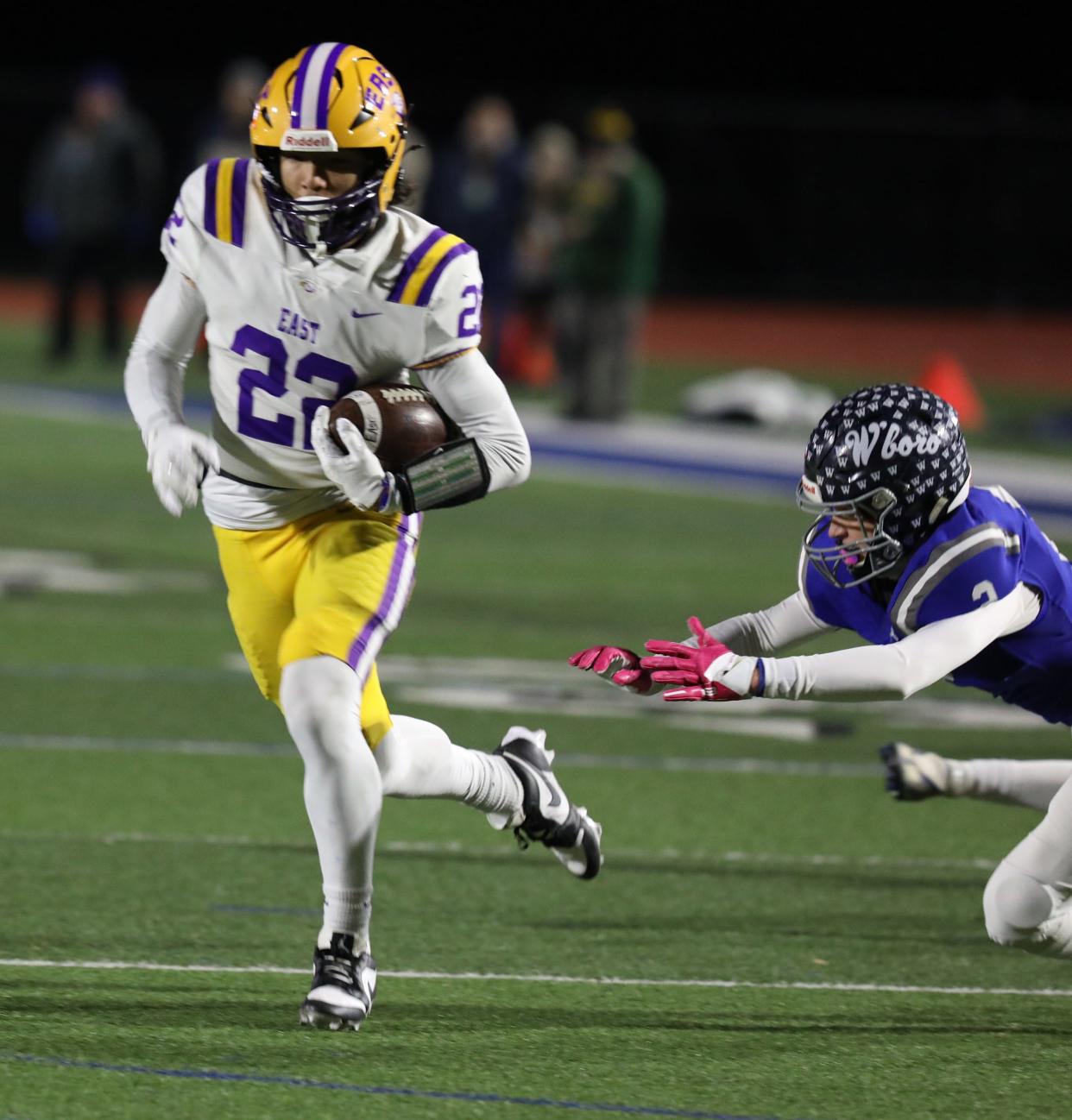 East/WOIS Anthony Diaz gets past Whitesboro's Brayden Czternastek before getting tackled.