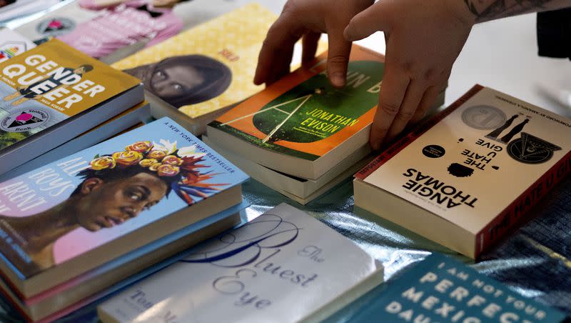 Books that have been challenged or banned are displayed and given away during a “Let Utah Read”  event at the Capitol in Salt Lake City on Wednesday, Jan. 25, 2023.