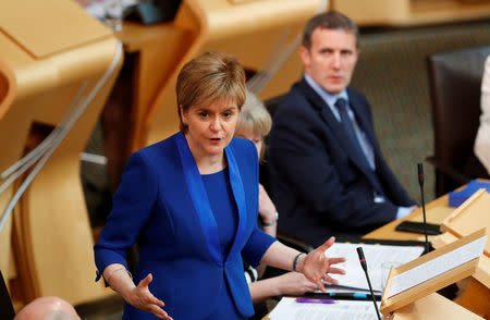 FILE PHOTO: Scotland’s First Minister, Nicola Sturgeon, addresses the Scottish Parliament in Edinburgh, Scotland June 27, 2017. REUTERS/Russell Cheyne/File Photo