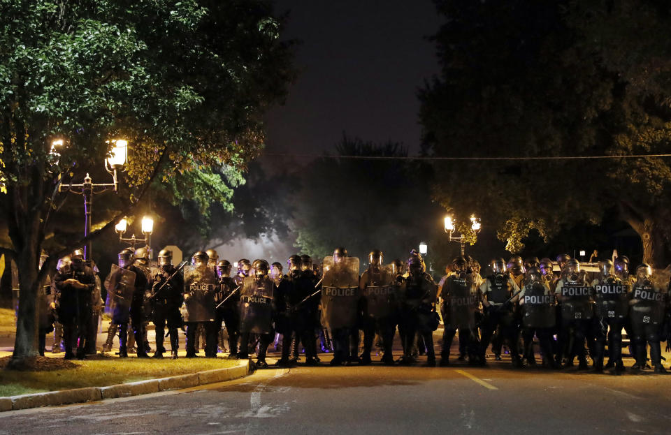 <p>Police line up as protesters gather, Friday, Sept. 15, 2017, in St. Louis, after a judge found a white former St. Louis police officer, Jason Stockley, not guilty of first-degree murder in the death of a black man, Anthony Lamar Smith, who was fatally shot following a high-speed chase in 2011. (Photo: Jeff Roberson/AP) </p>