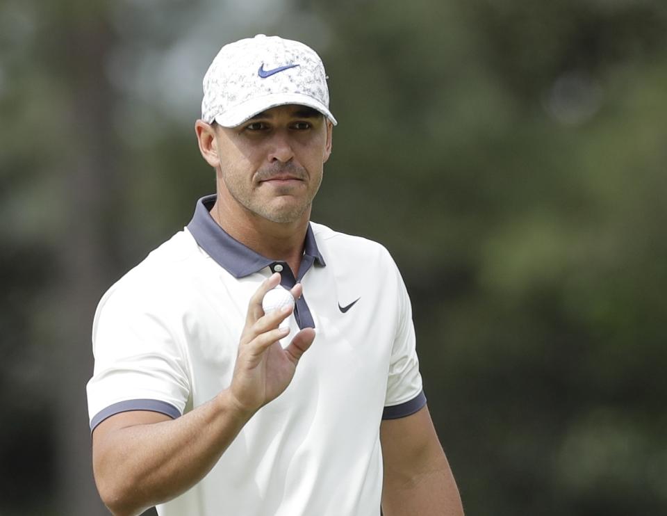 FILE - In this Friday, April 12, 2019, file photo, Brooks Koepka reacts after a birdie on the first hole during the second round for the Masters golf tournament in Augusta, Ga. The PGA Championship is set to begin May 16 on the Black Course at Bethpage State Park on New York's Long Island. (AP Photo/David J. Phillip, File)