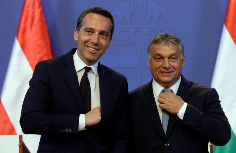 Austrian Chancellor Christian Kern (L) and Hungarian Prime Minister Viktor Orban (R) in Budapest, on July 26, 2016