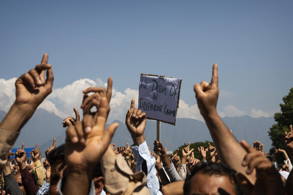 Kashmiri men shout freedom slogans during a protest against New Delhi's tightened grip on the disputed region, after Friday prayers on the outskirts of Srinagar, Indian controlled Kashmir, Aug. 23, 2019. The image was part of a series of photographs by Associated Press photographers which won the 2020 Pulitzer Prize for Feature Photography. (AP Photo/Dar Yasin)