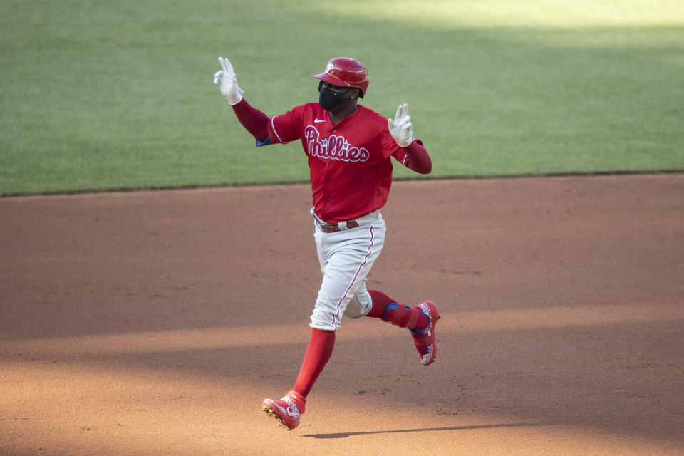 Philadelphia Phillies' Didi Gregorius celebrates as he rounds the bases for his three-run homer during the first inning of an exhibition baseball game against the Washington Nationals at Nationals Park, Saturday, July 18, 2020, in Washington. (AP Photo/Alex Brandon)