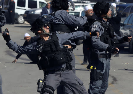 Israeli police fire tear gas canisters to disperse Druze protesters outside a polling station in Majdal Shams, October 30, 2018. REUTERS/Ammar Awad