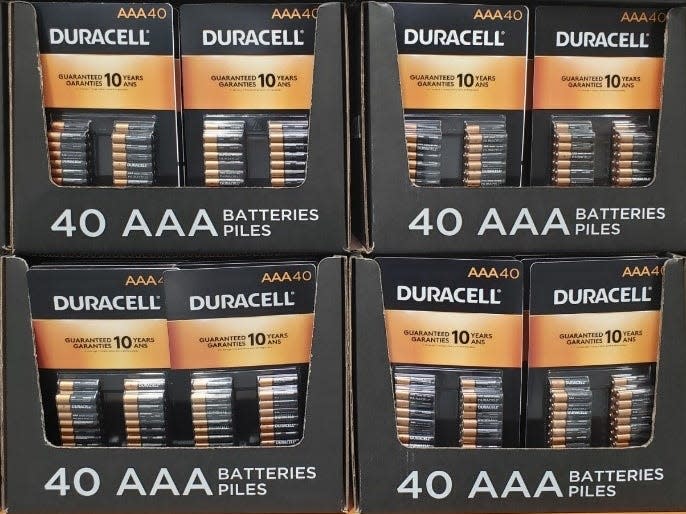 Boxes filled with Duracell AAA brown-and-black batteries at costco