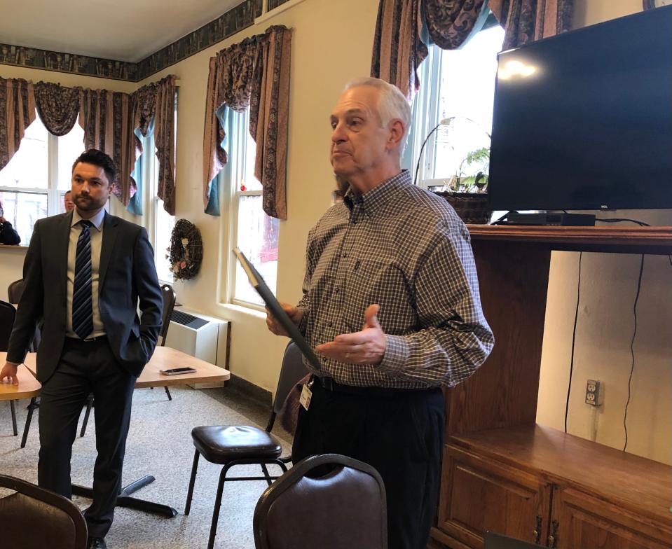 Carl Baxmeyer, right, president of the St. Joseph County Board of Commissioners, and county attorney Mike Misch inform residents at Portage Manor in South Bend on Feb. 7, 2023, that the facility would eventually close.