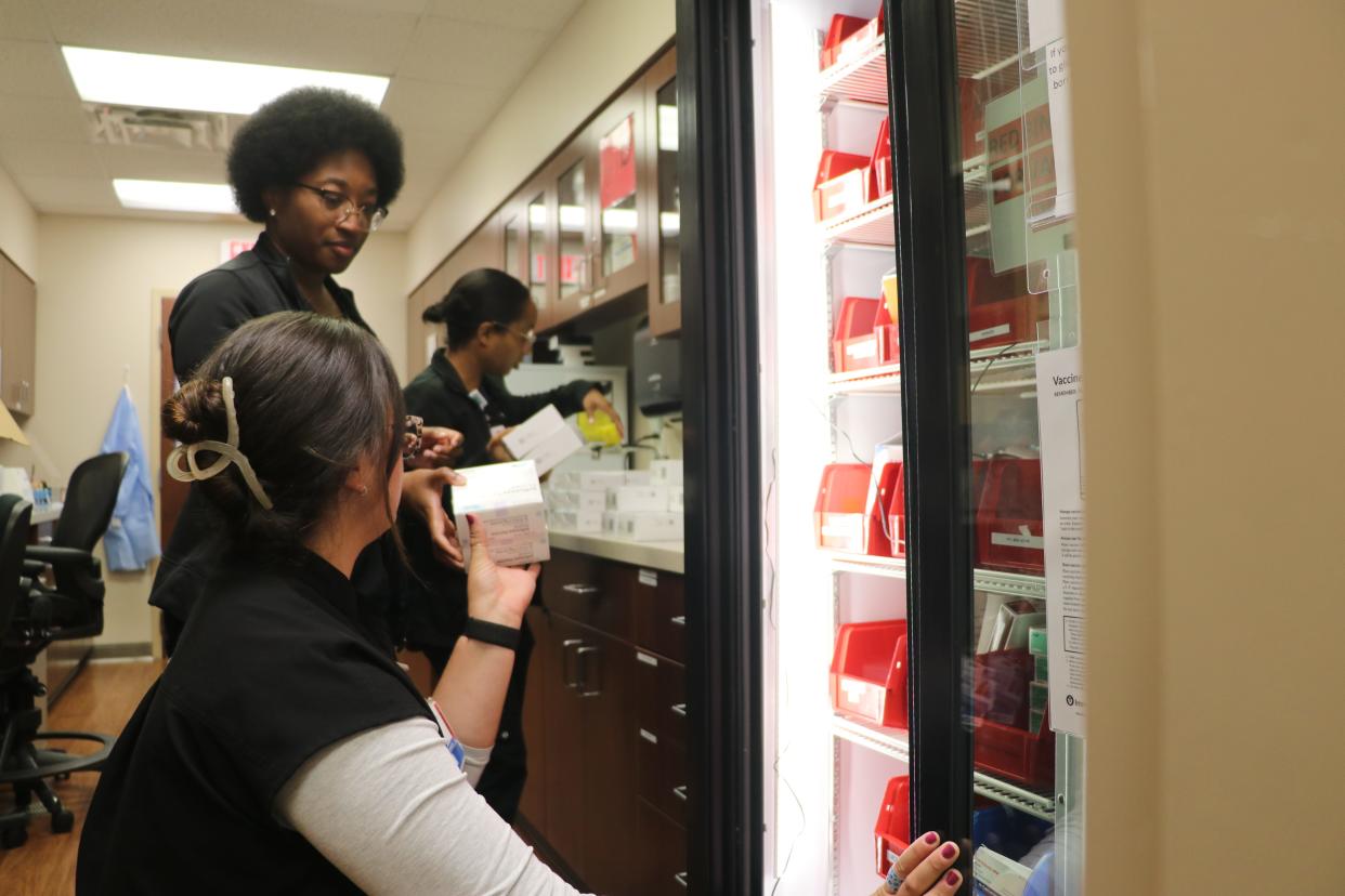 Aug. 23, 2024: Nurses at OhioHealth's Riverside Family Practice Kyle Shasteen, Ariel Winston and Chelsie Brantford (closest to farthest) organize a shipment of flu shots for the 2024 flu season.