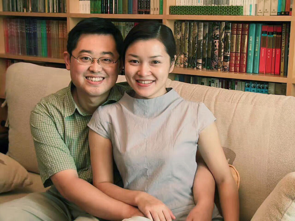 In this 2000 photo provided by ChinaAid, pastor Wang Yi, left, poses with his wife Jiang Rong at the study room of their home. China on Monday, Dec. 30, 2019, sentenced the prominent pastor who operated outside the Communist Party-recognized Protestant organization to nine years in prison. The People's Intermediate Court in the southwestern city of Chengdu said Wang Yi was also convicted of illegal business operations, fined and had his personal assets seized. (ChinaAid via AP)