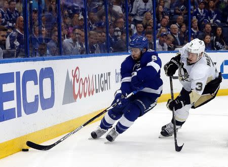 May 24, 2016; Tampa, FL, USA; Tampa Bay Lightning center Tyler Johnson (9) skates as Pittsburgh Penguins defenseman Olli Maatta (3) defends during the third period of game six of the Eastern Conference Final of the 2016 Stanley Cup Playoffs at Amalie Arena. Mandatory Credit: Kim Klement-USA TODAY Sports