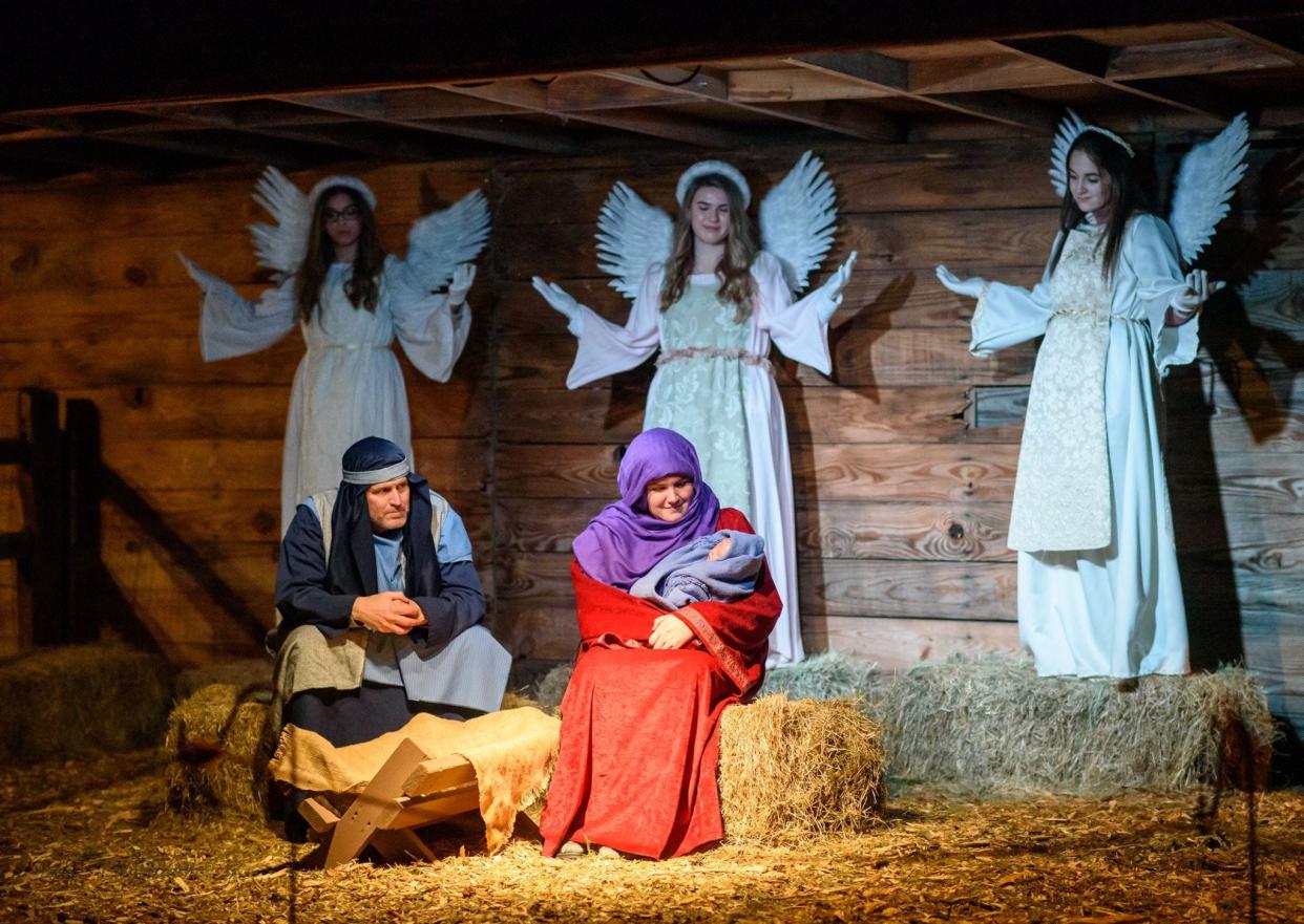 FILE - Grace United Methodist Church volunteers portray Jesus, Mary, Joseph and angels during "Return to Bethlehem" in North Augusta, SC. The event returns Dec. 6-9.