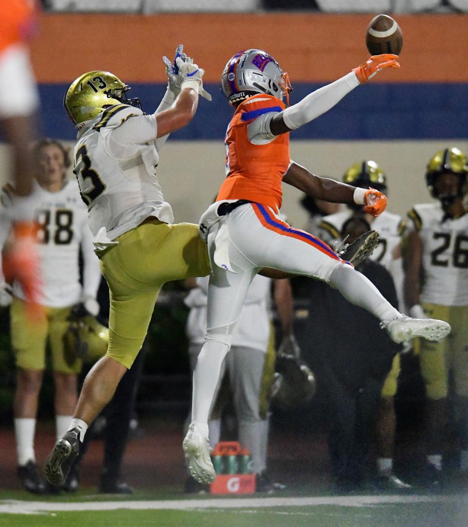 Bolles Bulldogs' Kavon Miller (3) breaks up a pass intended for Bishop Moore's Mylan Bowen (13) during late first quarter action. The Bolles Bulldogs hosted Orlando's Bishop Moore Hornets at Skinner-Barco Stadium in Jacksonville, FL Friday, November 18, 2022.