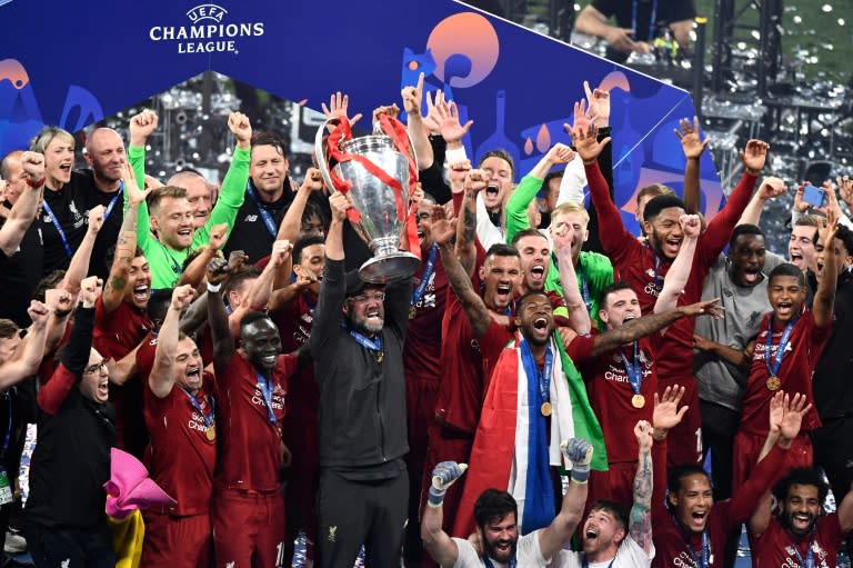 Jurgen Klopp lifts the Champions League trophy after <a class="link " href="https://sports.yahoo.com/soccer/teams/liverpool/" data-i13n="sec:content-canvas;subsec:anchor_text;elm:context_link" data-ylk="slk:Liverpool;sec:content-canvas;subsec:anchor_text;elm:context_link;itc:0">Liverpool</a> beat Tottenham to win the 2019 final (OSCAR DEL POZO)