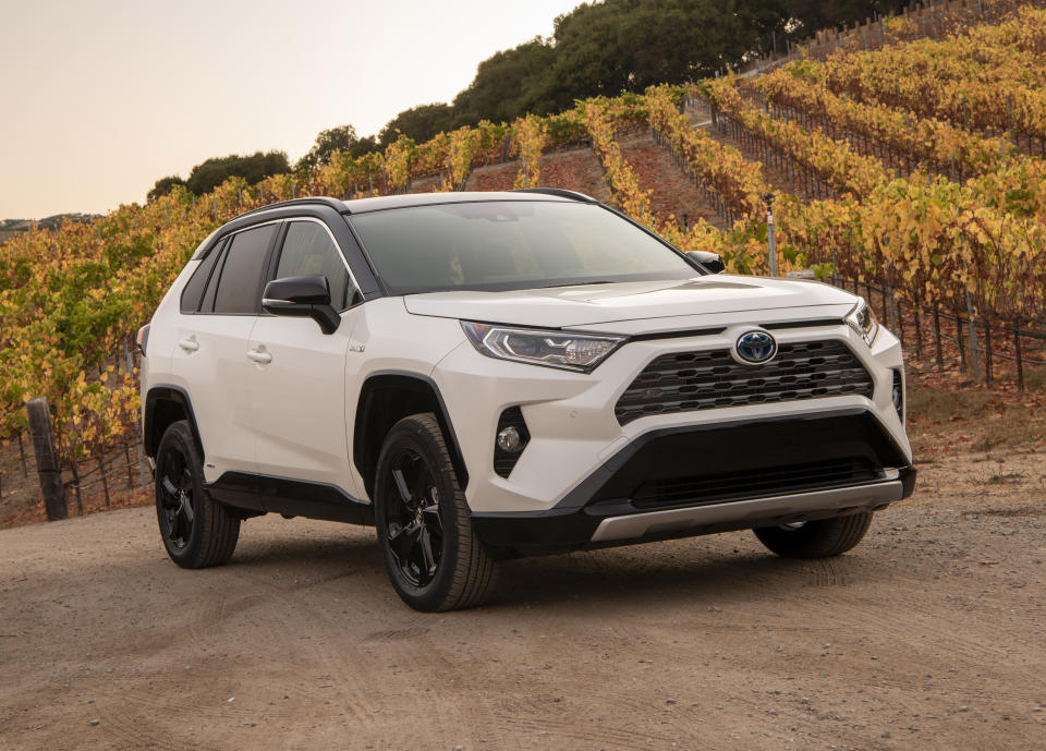 This photo provided by Toyota shows the 2020 Toyota RAV4 Hybrid. The RAV4 Hybrid is priced high enough on the used market that it's worth considering opting for new. (Courtesy of Toyota Motor Sales U.S.A. via AP)