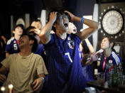 <p>Japanese fans react after second goal by Belgium as they watch a broadcast of the World Cup Round of 16 soccer match Belgium vs Japan at a sports bar in Tokyo, Japan July 3, 2018. REUTERS/Issei Kato </p>