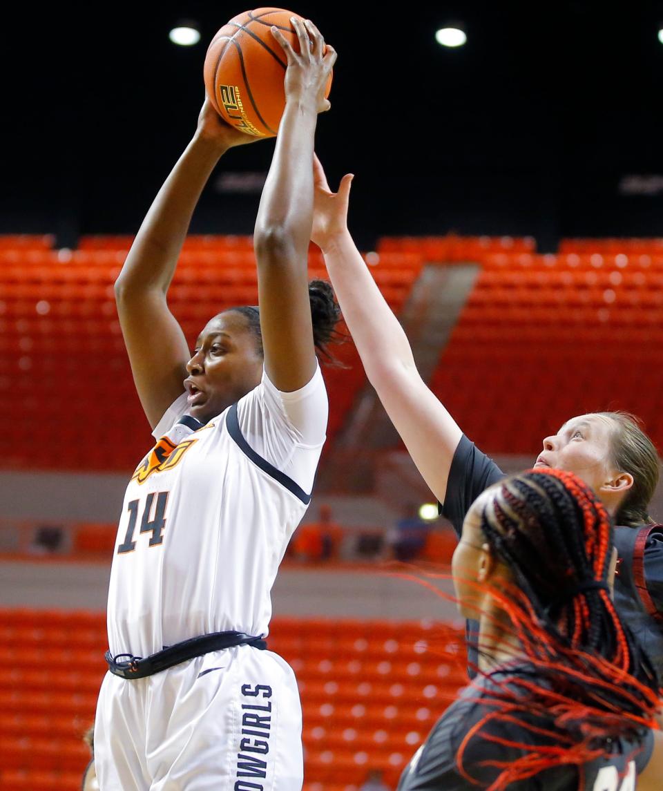 Oklahoma State's Taylen Collins (14) tied the program record for rebounds in a game with 23 in a win over North Texas on Saturday.