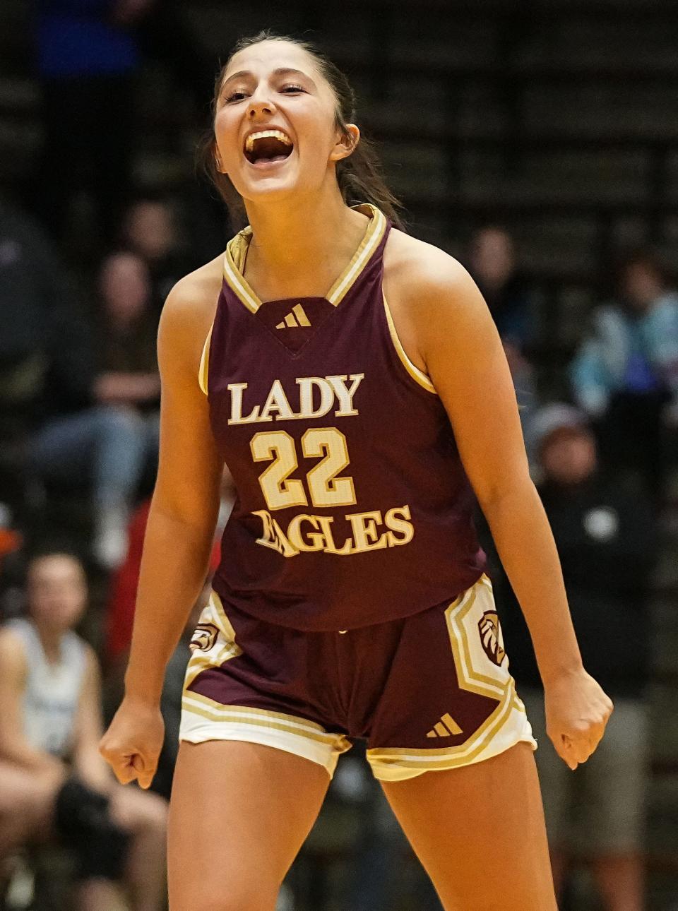 Columbia City Eagles guard Tessa Tonkel (22) yells in excitement Thursday, Oct. 5, 2023, during the Hall of Fame Classic girls basketball tournament at New Castle Fieldhouse in New Castle. The Columbia City Eagles defeated the Jennings County Panthers, 56-47.