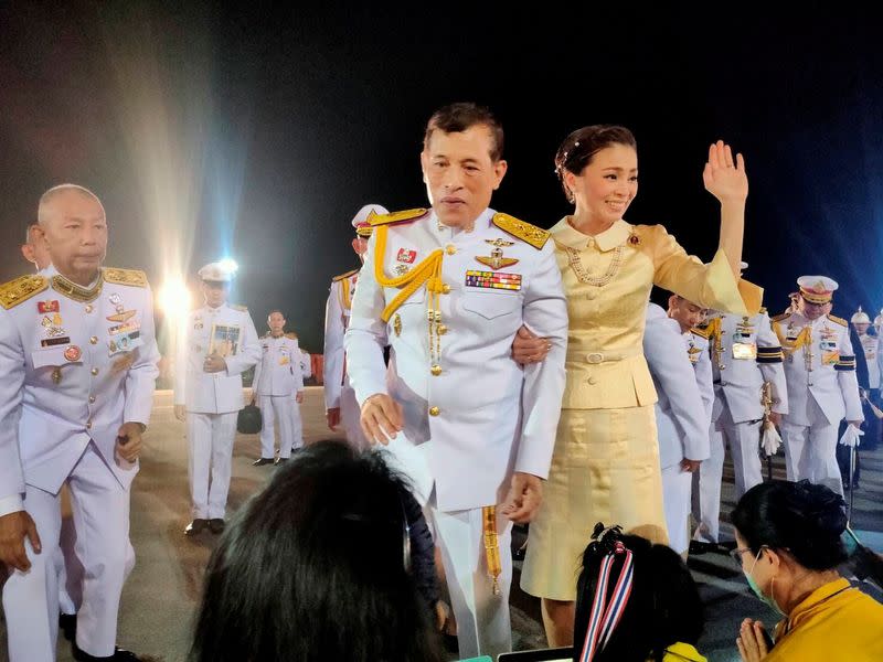 Thailand's King Maha Vajiralongkorn and Queen Suthida greet royalists at an airport in Udon Thani province