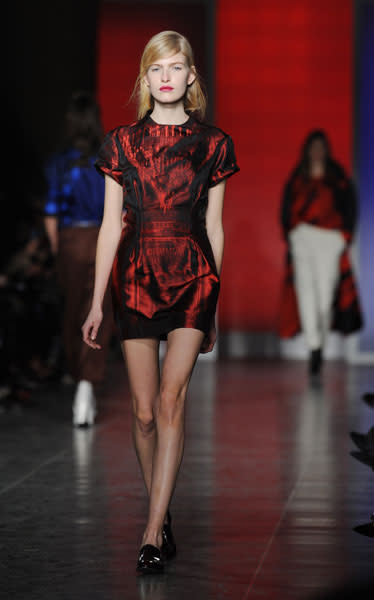 <b>LFW AW13: Paul Smith </b><br><br>We loved this red mini dress and black patent brogues ensemble.<br><br>© Getty