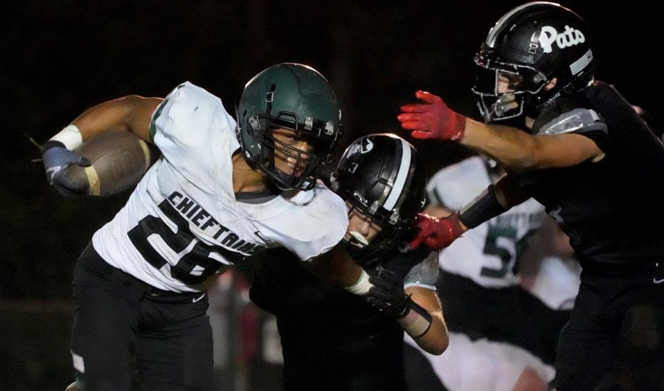 Ponaganset running back Jason Pincince fights for yardage in the second half of Thursday's game against Pilgrim.