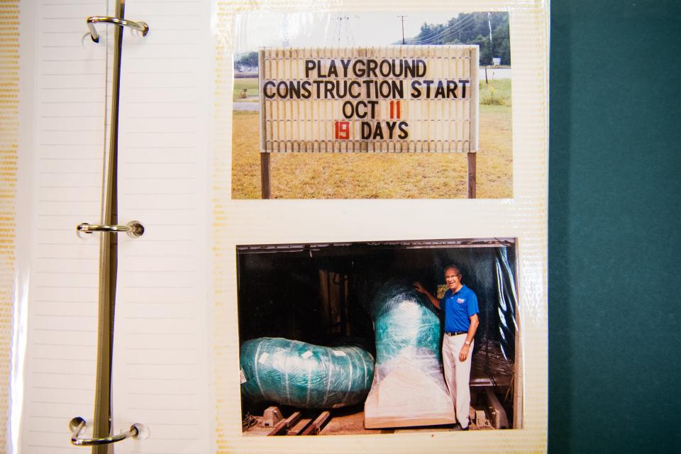 Photos of the preparation and construction of the Claxton Community Playground in 2000 are seen in a photo album kept at the Claxton Community Center.