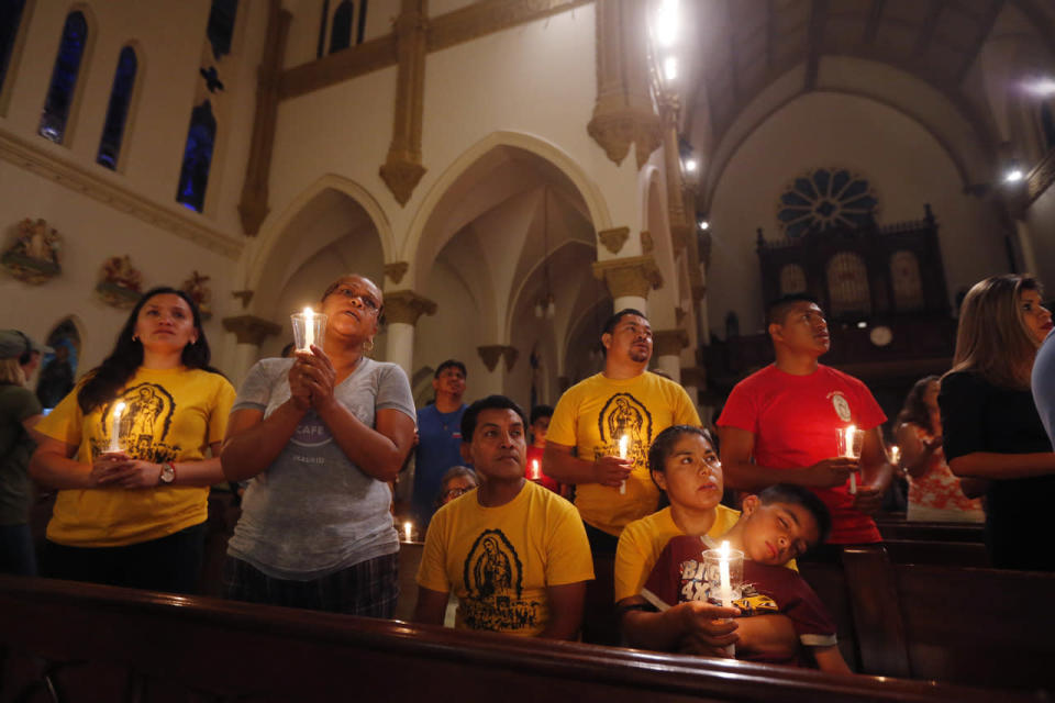 Worshipers participate in a “United To Heal Prayer Vigil” at Cathedral Guadalupe