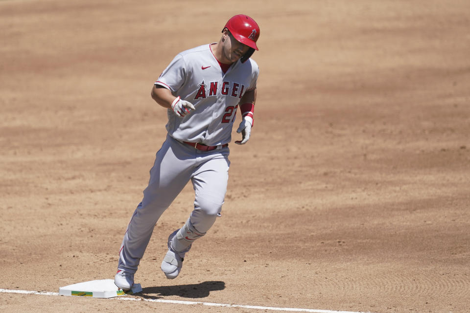 Los Angeles Angels' Mike Trout rounds the bases after hitting a three-run home run against the Oakland Athletics during the third inning of a baseball game in Oakland, Calif., Sunday, July 26, 2020. (AP Photo/Jeff Chiu)