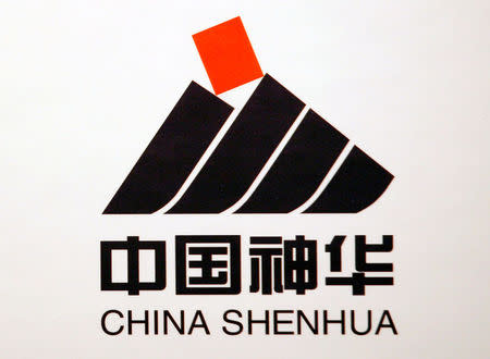 FILE PHOTO: A company logo of China Shenhua Energy Co Ltd is displayed at a news conference in Hong Kong, China March 16, 2010. REUTERS/Bobby Yip/File Photo