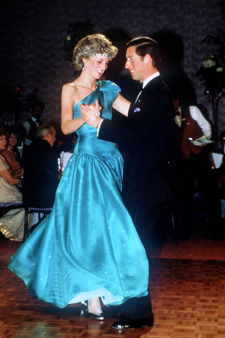 <p>During a 1985 visit to Melbourne with Prince Charles, Diana accessorized her gown with a makeshift tiara: the Princess strung an emerald-and-diamond choker across her forehead. </p>