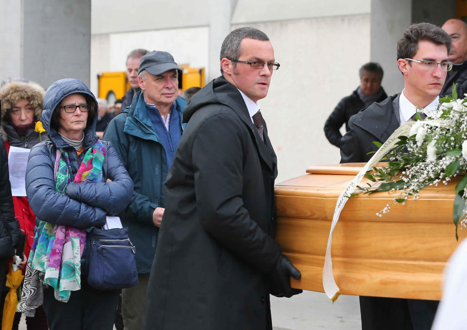 FILE - In this Feb. 12, 2016 file photo, the father Claudio and the mother Paola, left, of Giulio Regeni follow his coffin during the funeral service in Fiumicello, Northern Italy. Four high-level Egyptian security officials are going on trial Tuesday, Feb. 20, 2024, in absentia in a Rome court, accused in the 2016 abduction, torture and slaying of an Italian doctoral student in Cairo. (AP Photo/Paolo Giovannini, File)