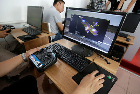 Trainees learn through simulation flight at LTFY drone training school on the outskirts of Beijing, China July 27, 2017. Picture taken July 27, 2017. REUTERS/Jason Lee