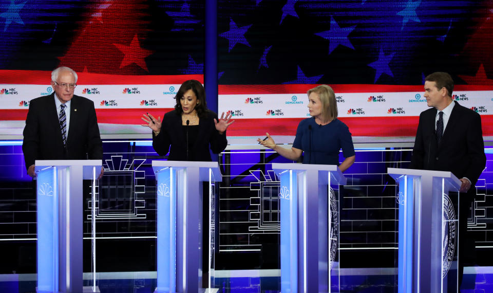 MIAMI, FLORIDA - JUNE 27: Democratic presidential candidates (L-R) Sen. Bernie Sanders (I-VT), Sen. Kamala Harris (D-CA), Sen. Kirsten Gillibrand (D-NY) and Sen. Michael Bennet (D-CO) take part in the second night of the first Democratic presidential debate on June 27, 2019 in Miami, Florida.  A field of 20 Democratic presidential candidates was split into two groups of 10 for the first debate of the 2020 election, taking place over two nights at Knight Concert Hall of the Adrienne Arsht Center for the Performing Arts of Miami-Dade County, hosted by NBC News, MSNBC, and Telemundo. (Photo by Drew Angerer/Getty Images)