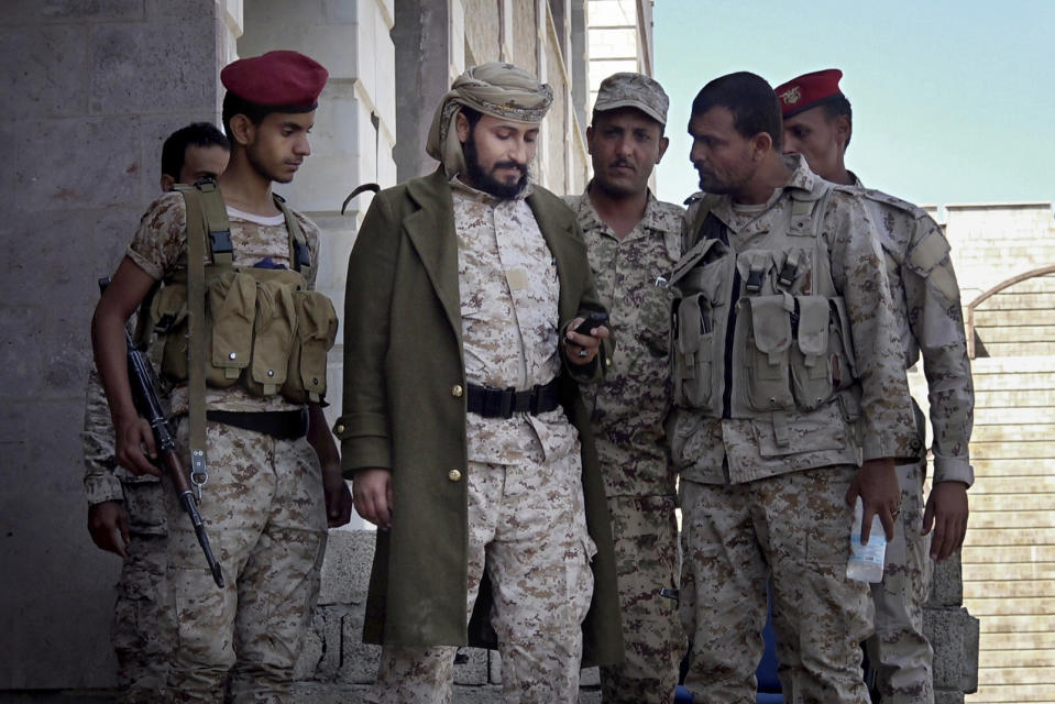 Adnan Rouzek, center, a Salafi militia leader backed by Yemen’s president, stands with fighters in Taiz, Yemen, in this Feb. 6, 2018, photo. Rouzek was named a top commander with a rank of colonel by the president and recently given $12 million to fight the Houthi rebels in Taiz, but security officials in the city say he has used al-Qaida militants in his forces. His top aide is a senior al-Qaida figure who escaped from prison in 2008, they say. His militia became notorious for kidnappings and street killings. (AP Photo)