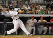 NEW YORK, NY - APRIL 15: Russell Martin of the New York Yankees breaks his bat hitting into a double play against the Los Angeles Angels of Anaheim at Yankee Stadium on April 15, 2012 in the Bronx borough of New York City. In honor of Jackie Robinson Day, all players across Major League Baseball will wear number 42. (Photo by Nick Laham/Getty Images)