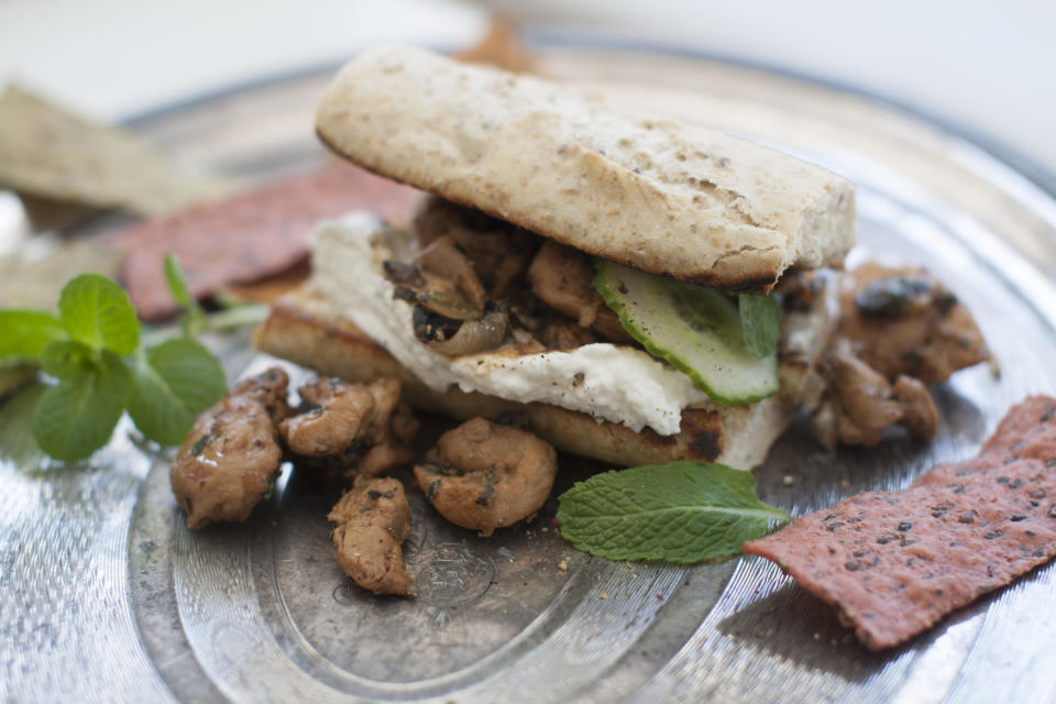 This March 24, 2014 photo shows minted lemon and olive chicken wraps in Concord, N.H. (AP Photo/Matthew Mead)