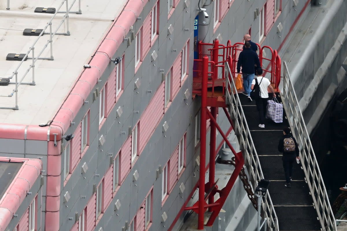 First arrivals on controversial barge (AFP via Getty Images)