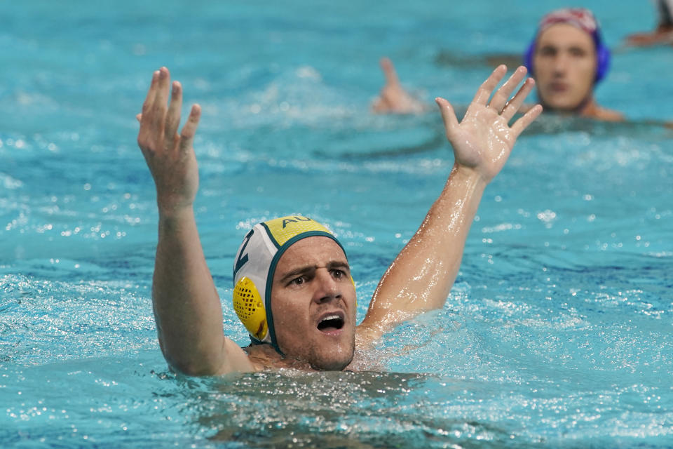 Australia's Lachlan Robert Edwards (12) reacts to an official's call that took away an apparent goal against Croatia during a preliminary round men's water polo match at the 2020 Summer Olympics, Tuesday, July 27, 2021, in Tokyo, Japan. (AP Photo/Mark Humphrey)