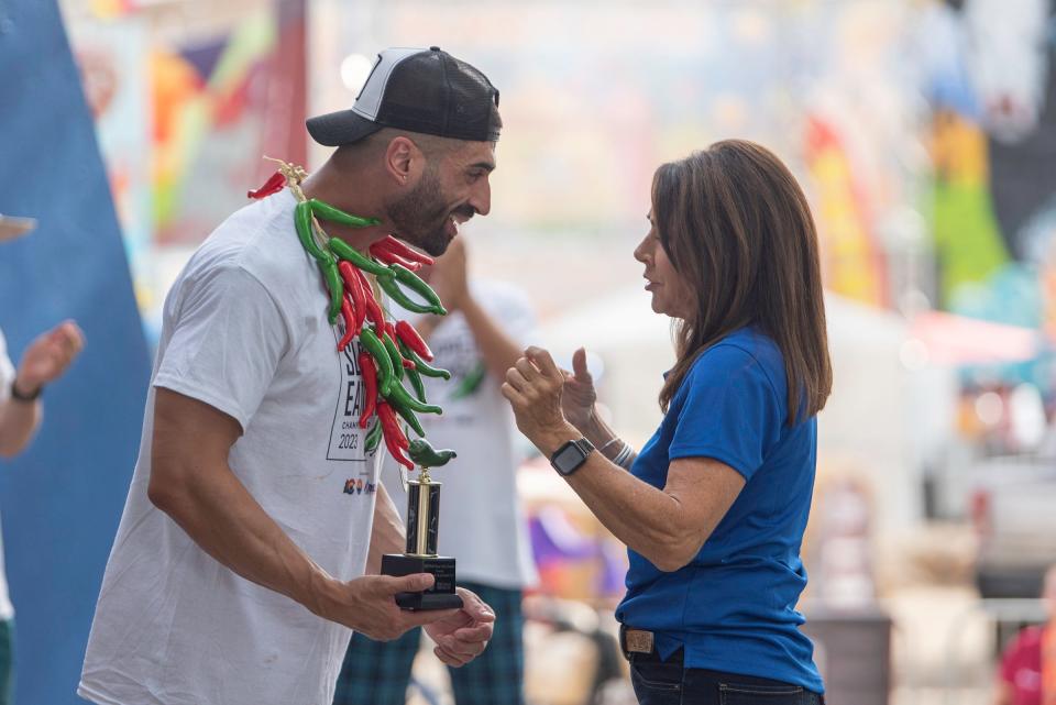 James Webb receives the chile trophy and necklace after becoming the 2023 World Slopper Eating Champion at the Colorado State Fair in Pueblo on Saturday, September 1, 2023.