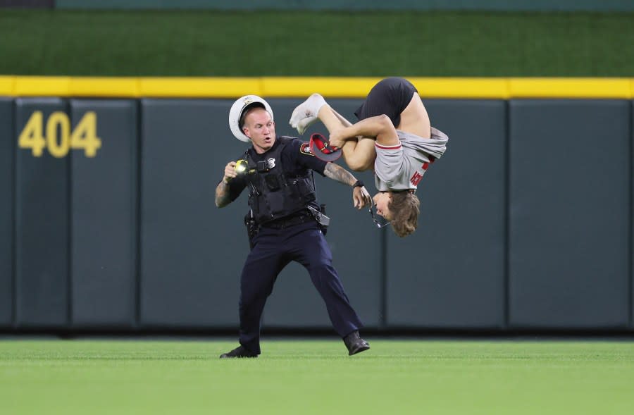 CINCINNATI, OHIO – JUNE 11: An unidentified fan does a flip on the field before the ninth inning of the Cincinnati Reds against Cleveland Guardians at Great American Ball Park on June 11, 2024 in Cincinnati, Ohio. (Photo by Andy Lyons/Getty Images)