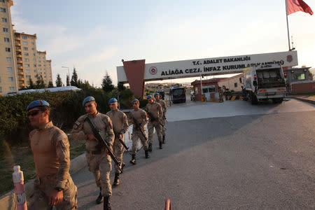 Soldiers walk in front of the Aliaga Prison and Courthouse complex in Izmir, Turkey October 12, 2018. REUTERS/Umit Bektas