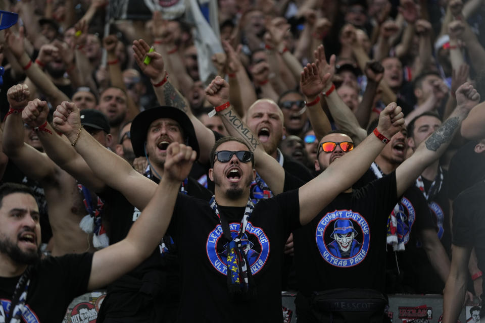 Supporters cheer before the Champions League semifinal first leg soccer match between Borussia Dortmund and Paris Saint-Germain at the Signal-Iduna Park stadium in Dortmund, Germany, Wednesday, May 1, 2024. (AP Photo/Matthias Schrader)