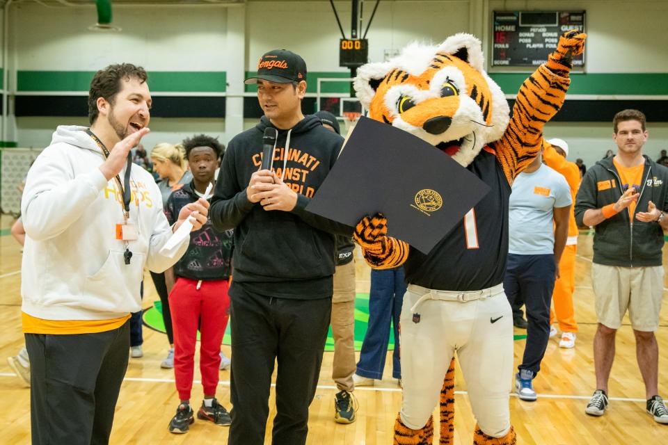 Mayor Aftab Pureval alongside Bengals mascot Who Dey presents a proclamation to Adam Turer, volunteer chair of the Saturday Hoops program, declaring March 9, 2024 as "Saturday Hoops Day" in Cincinnati. Saturday Hoops is celebrating its 20th anniversary all year long.