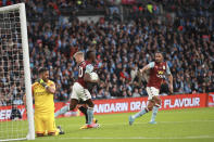 Manchester City's goalkeeper Claudio Bravo reacts as Aston Villa's Mbwana Samatta, center, runs off with the ball after scoring his side's first goal during the League Cup soccer match final between Aston Villa and Manchester City, at Wembley stadium, in London, England, Sunday, March 1, 2020. (AP Photo/Ian Walton)